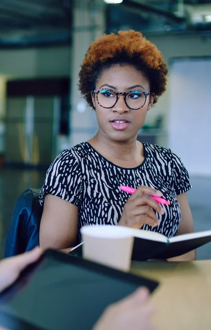 Unposed group of creative business people in an open concept office brainstorming their next project.-4 (1) copy